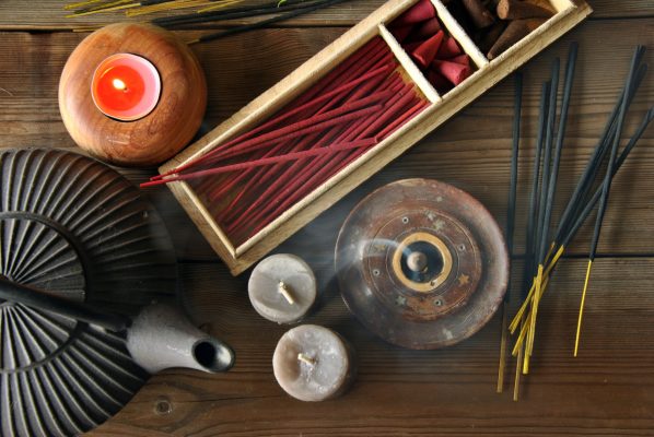 various types of incense next to teapot