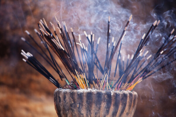 burning traditional incense sticks
