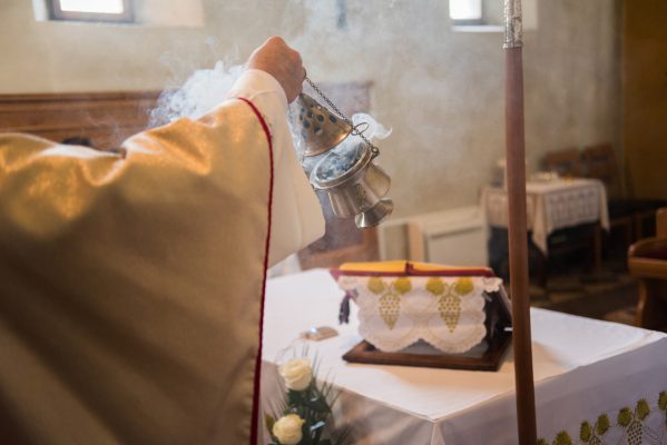 incense being burned in a censer during mass