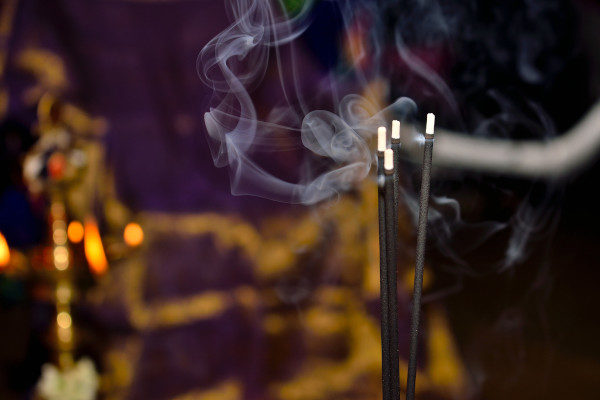 incense sticks and statue