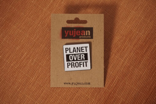 planet over profit enamel pin